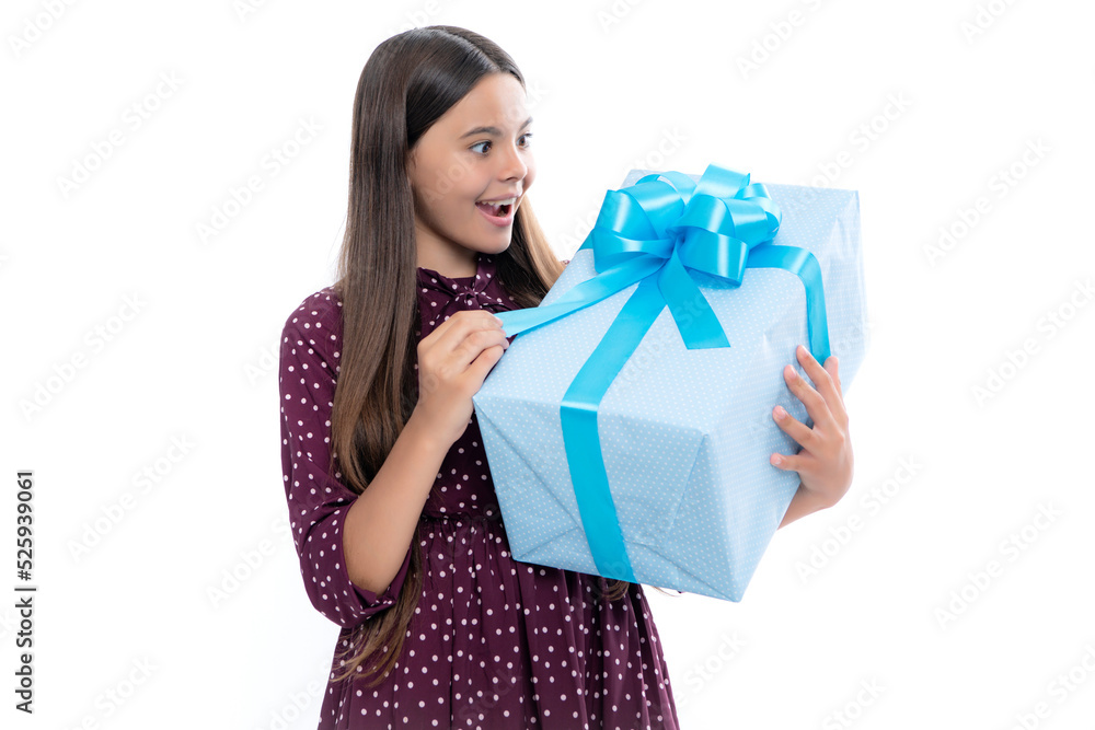 Emotional teenager child hold gift on birthday. Funny kid girl holding gift boxes celebrating happy New Year or Christmas. Emotional teenager child hold gift on birthday. Funny kid girl holding gift boxes celebrating happy New Year or Christmas.