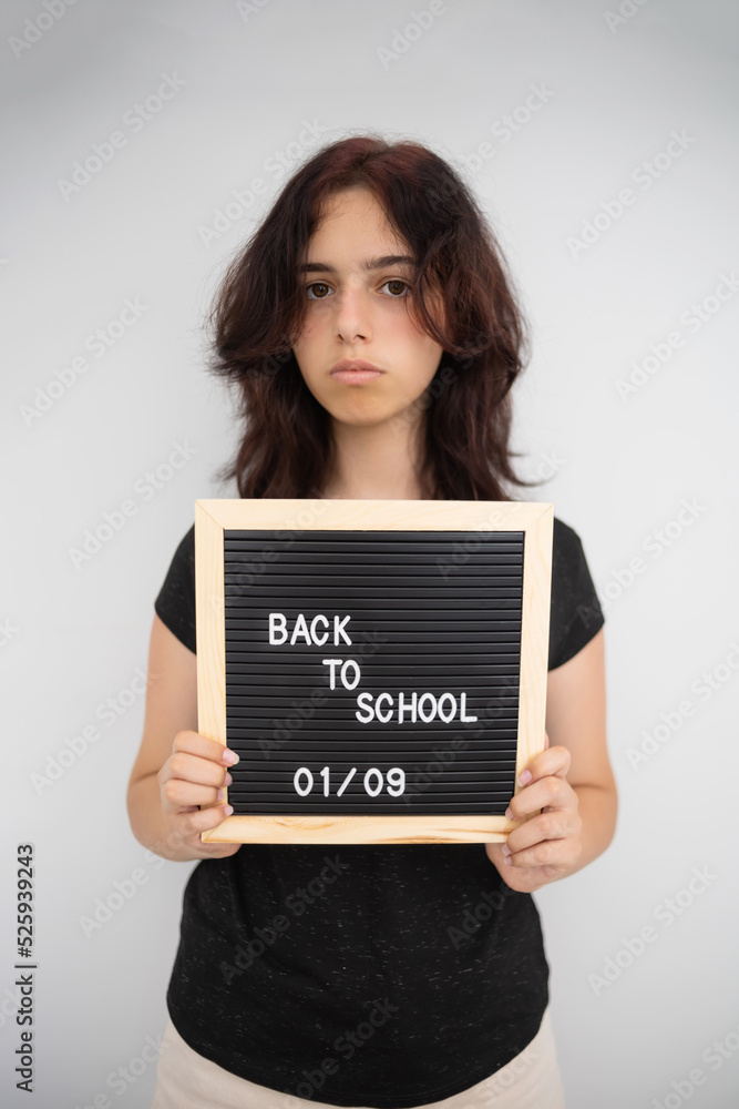 Back to school concept. Unhappy high school student Back to school concept. Unhappy high school student