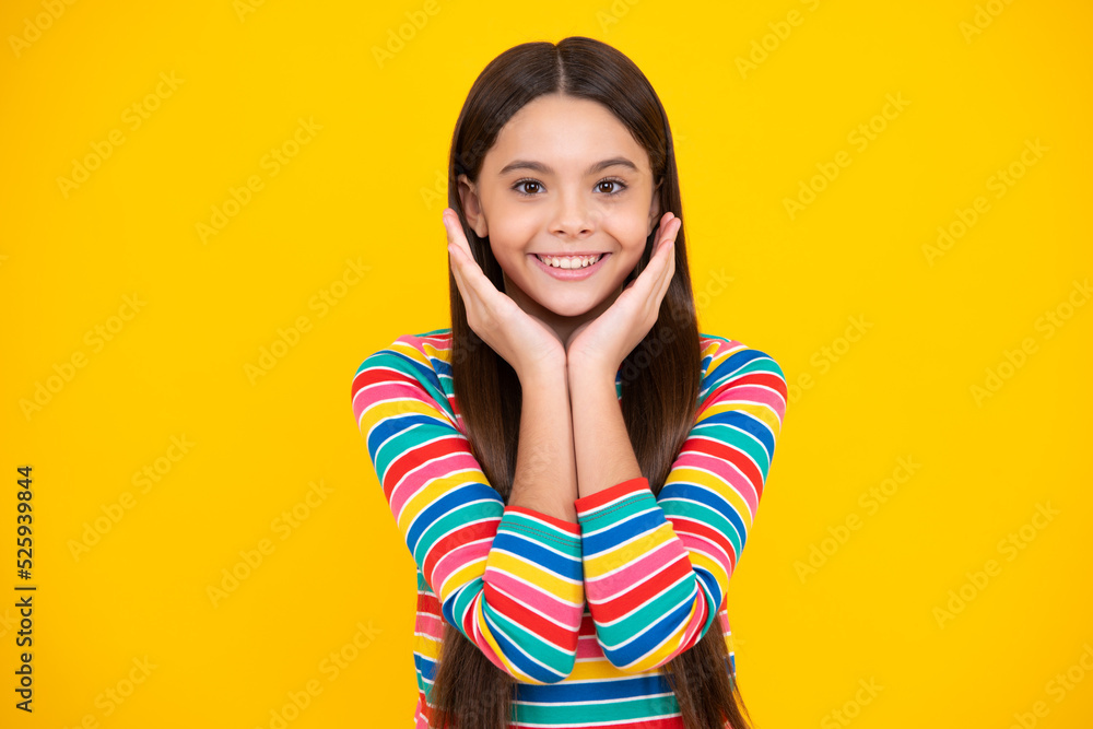Happy face, positive and smiling emotions of teenager girl. Emotional portrait of caucasian teenager child girl isolated on studio yellow background. Happy face, positive and smiling emotions of teenager girl. Emotional portrait of caucasian teenager child girl isolated on studio yellow background.