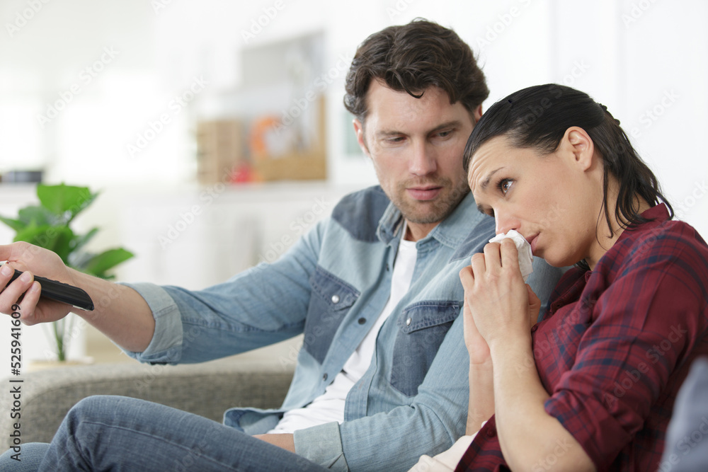 couple watching soap opera in evening couple watching soap opera in evening