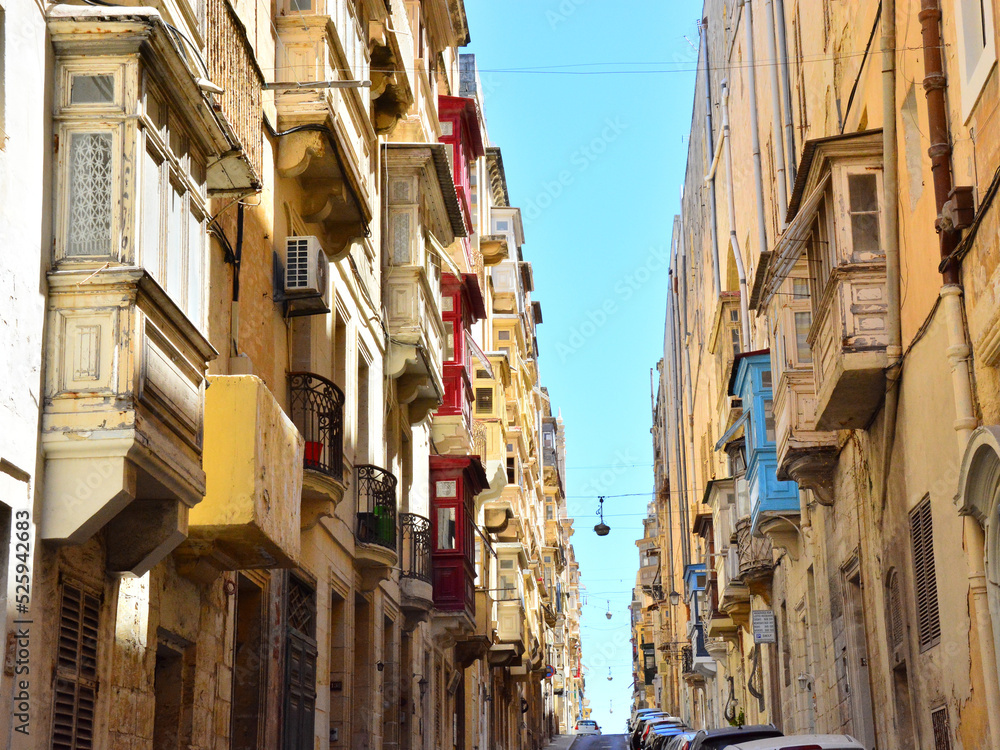  Street view of Valletta; traditional colorful balconies in the old city of Valletta,  Maltese residential architecture, windows