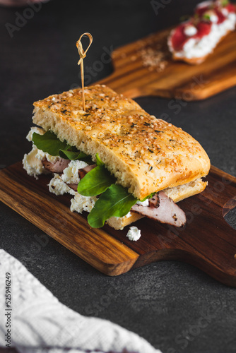 gourmet sandwich photography with dark background and selective focus