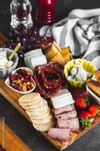 cheese platter with dark background and selective focus
