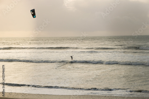 A kitesurfer practices surfing near Penzance, Cornwall, UK