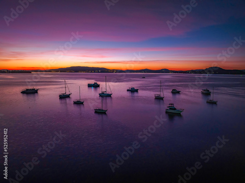 Dawn Colour Palette over the bay with boats and high cloud