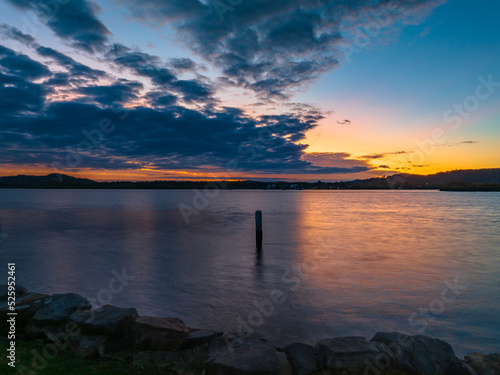 Sunrise over the bay with cloud cover moving in