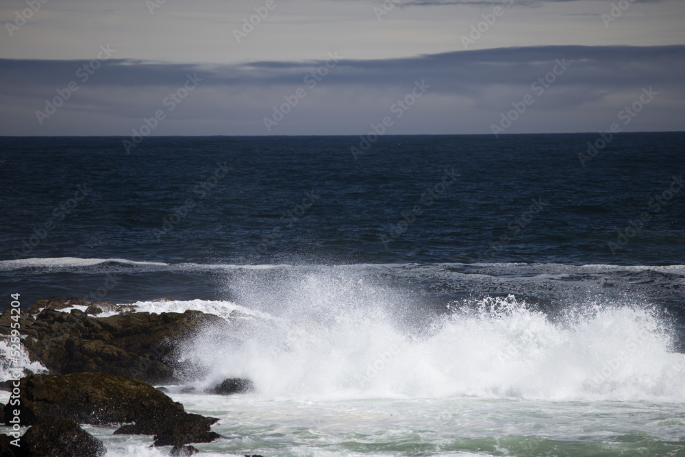Ocean waves crashing onto a rocky shore