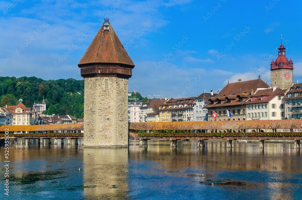 view of the town and covered bridge in Lucerne Switzerland view of the town and covered bridge in Lucerne Switzerland