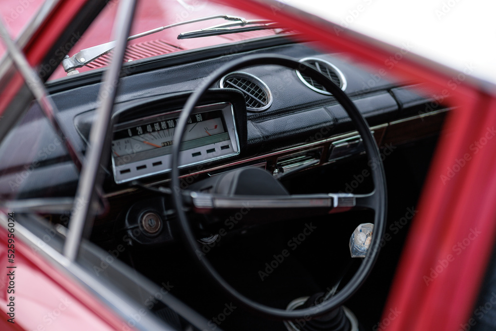 Fototapeta premium dashboard, car interior, automatic tachometer of an old red car