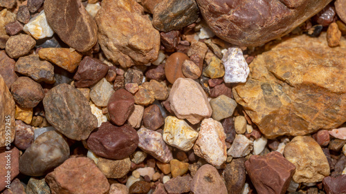Abstract nature pebbles background. Brown pebbles texture. Stone background. Natural seamless stone texture background