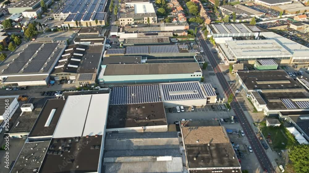 Aerial of buildings with solar panels on rooftop at a large industrial terrain Aerial of buildings with solar panels on rooftop at a large industrial terrain