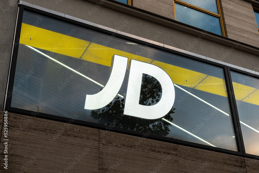 BERLIN, GERMANY - 12. August 2022: JD Sports Fashion logo on a store  facade. Illuminated letters as advertising of the retailer in the city.  Shopping for sportswear clothing and shoes. Stock Photo | Adobe Stock