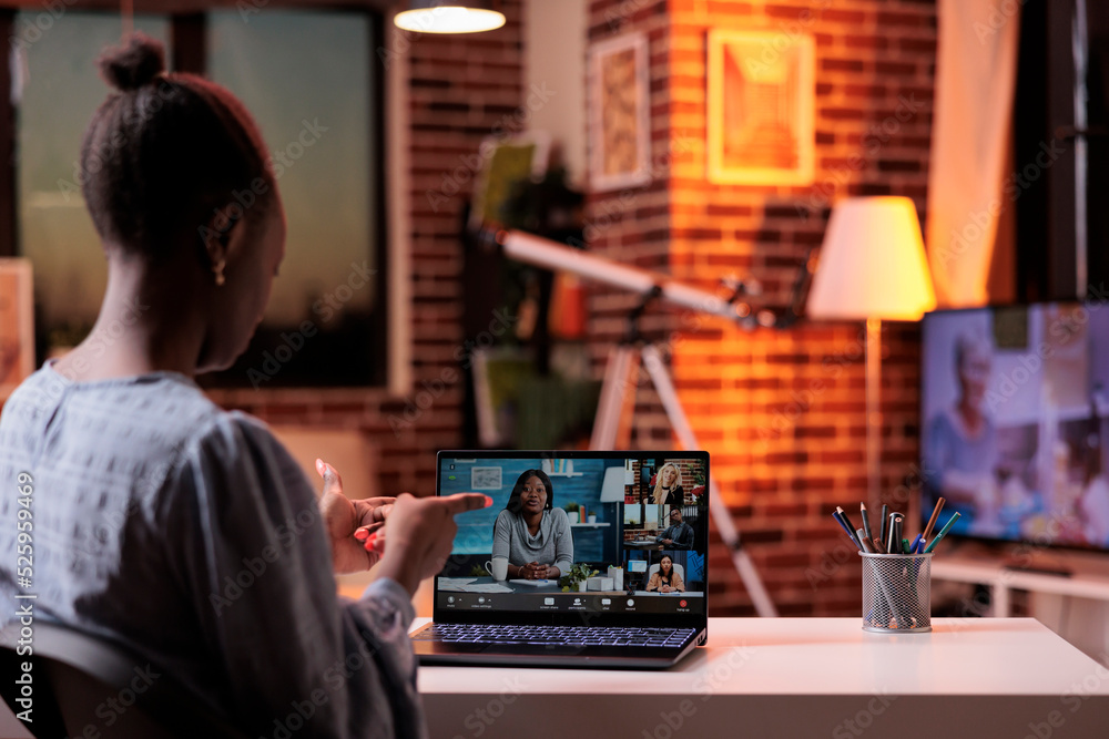 Woman attending online job interview, speaking with HR manager on videocall using laptop, back view. Teleconference with coworkers, remote team brainstorming on business meeting Woman attending online job interview, speaking with HR manager on videocall using laptop, back view. Teleconference with coworkers, remote team brainstorming on business meeting