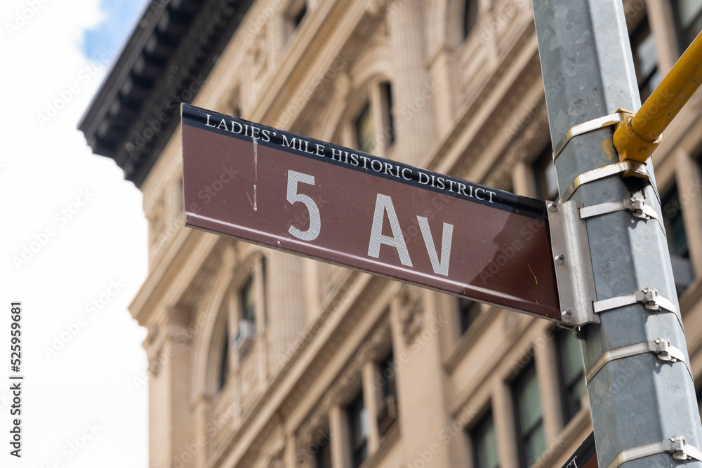 Obraz premium New York City, USA - August 22, 2022: Close up of 5 AV street sign is seen in New York City, USA. 5 AV (Fifth Avenue) is a major thoroughfare in the borough of Manhattan. 