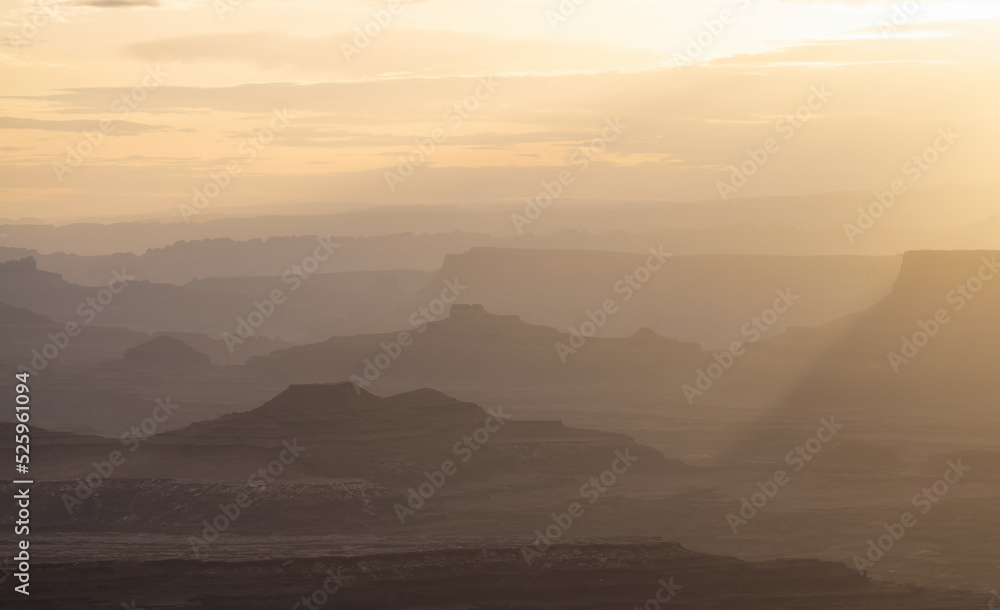 Scenic American Landscape and Red Rock Mountains in Desert Canyon. Spring Season. Canyonlands National Park. Utah, United States. Nature Background. Golden Sunset