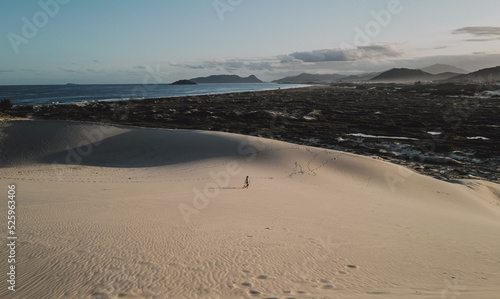 Sand dunes near the ocean with san d board in Brazil  Florianopolis