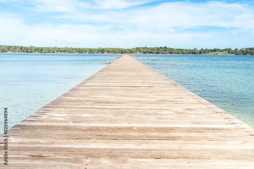 The wood floor extends into the sea. space for product or object presentation The wood floor extends into the sea. space for product or object presentation