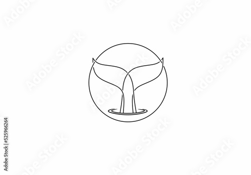 whale fin on the background of the sun on the ocean