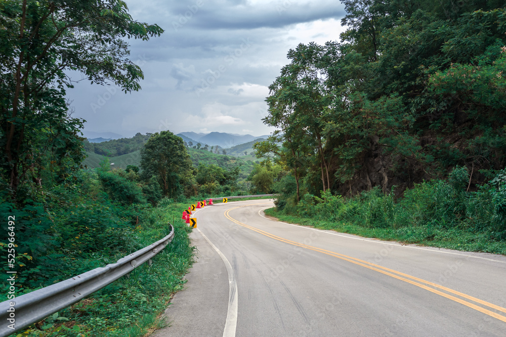 Fototapeta premium Country Road with Mountain and blue sky