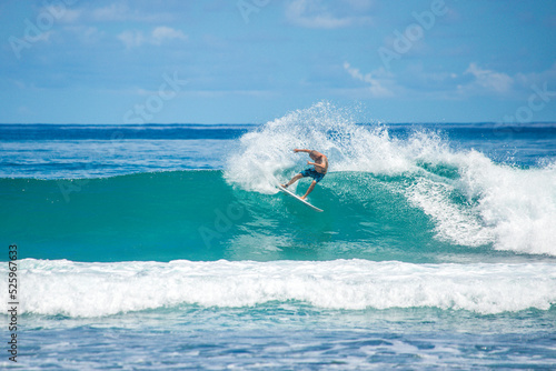 Cuadro en lienzo Surfer riding blue wave at Mentawai islands, Sumatra, Indonesia
