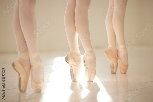 Ballet dance woman legs in studio training, exercise and working on performance for competition. Ballerina shoes, teamwork and creative art academy school students learning dancing routine