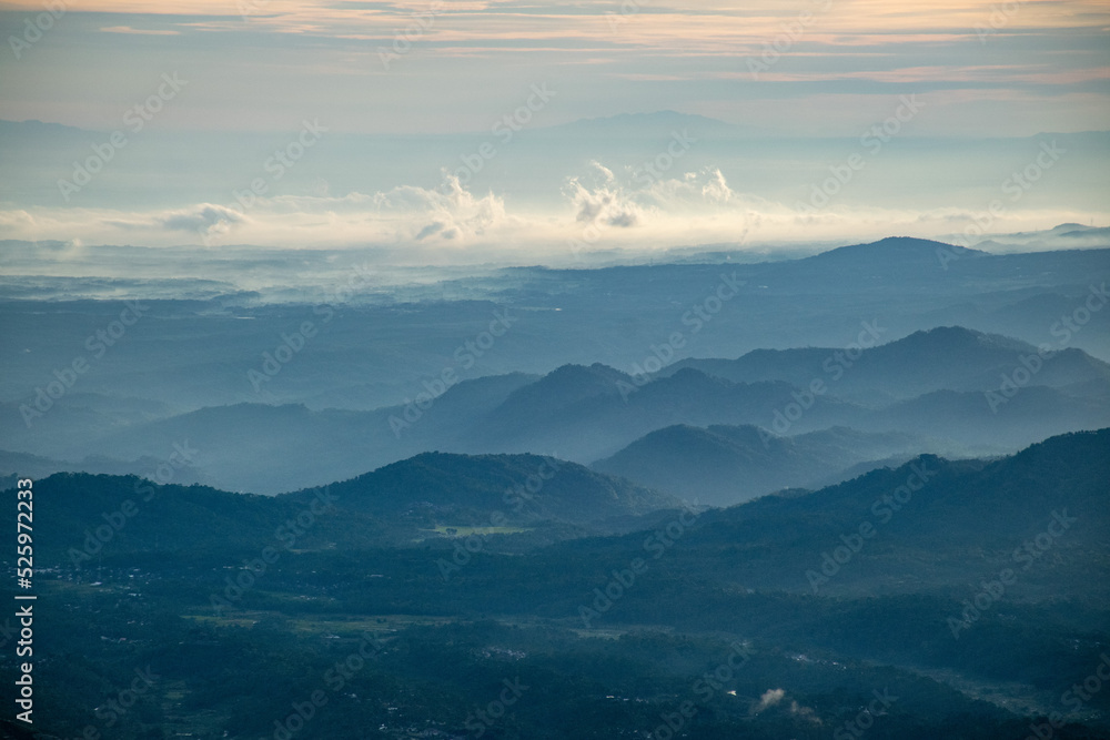 Fototapeta premium Sunrise at the peak of Si Kunir in the Dieng Plateau, Wonosobo, Central Java Indonesia 