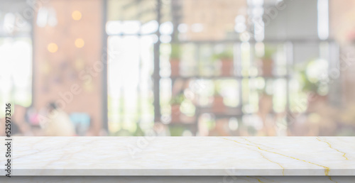marble table top with blurred kitchen cafe restaurant interior background © Piman Khrutmuang