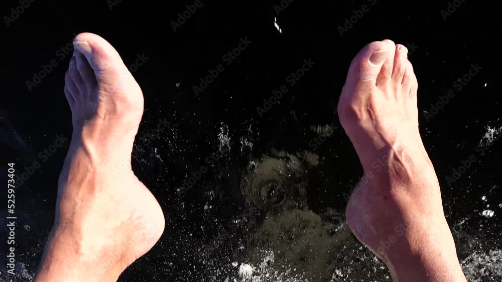 Stockholm, Sweden Feet dangling off of a motorboat's bow in the summer sun. Stockholm, Sweden Feet dangling off of a motorboat's bow in the summer sun.