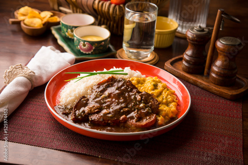 Fried cow liver with locro pumpkin stew Buffet table Peruvian comfort restaurant gourmet food