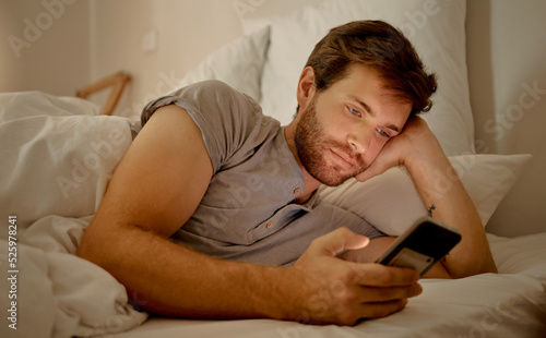 Fotografie Insomnia, bored and social media in bed to destress and calm
