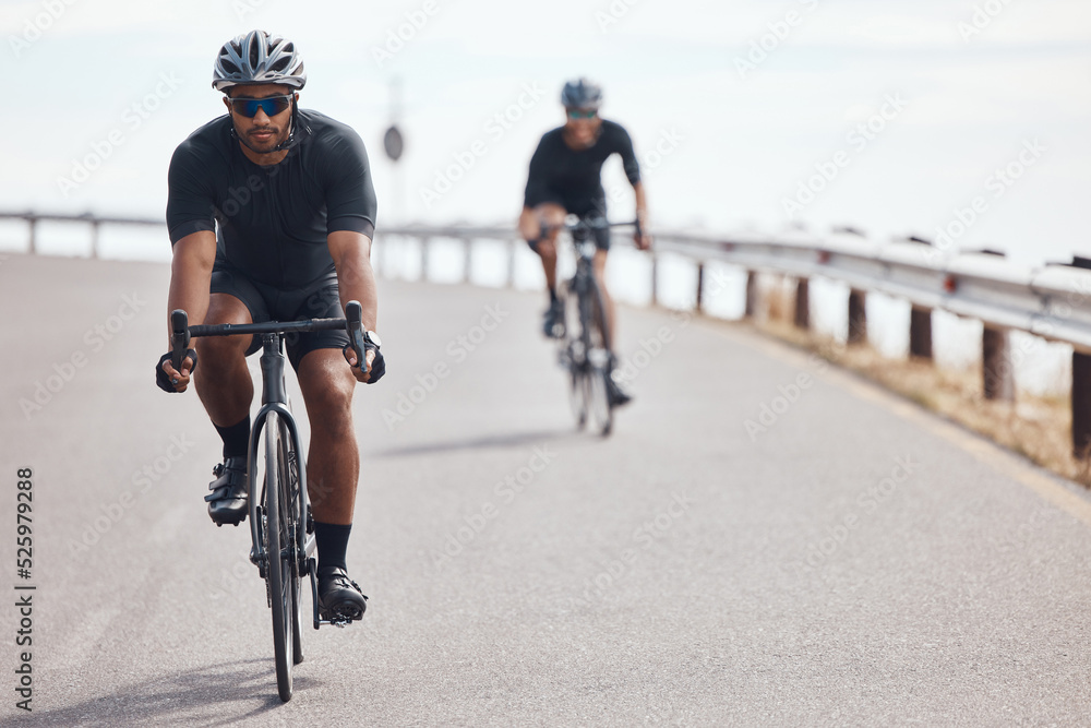 Bike, fitness and exercise with a man cyclist training on a bicycle for sport, health or exercise outside. Sports, wellness or fitness with a healthy athlete doing a workout for cardio and endurance