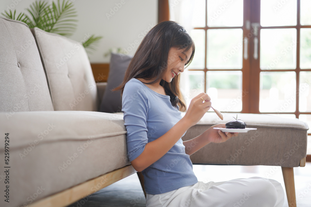 Work from home concept, Business women eats dessert to take a break while working remotely at home