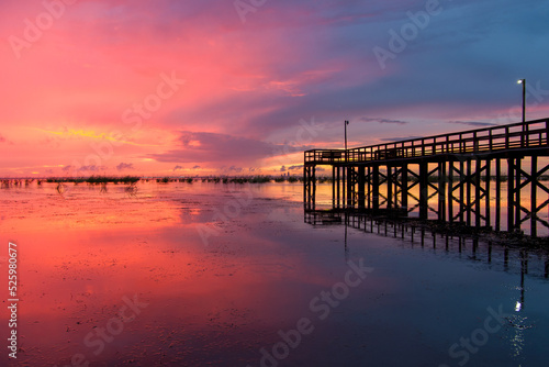 Pier on Mobile Bay at sunset photo