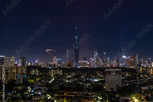 Kuala Lumpur city skyline with Genting Highland behind the view.