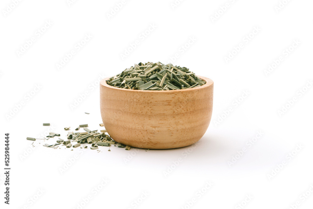Dry lemongrass leaf slice in wooden bowl isolated on white background. Dry lemongrass leaf slice in wooden bowl isolated on white background.