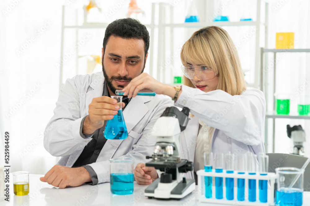 The scientist doctor created a vaccine against the coronavirus.Coronavirus 2019-nCoV Blood Sample. virus outbreaking.Technician holding blood tube test in the research laboratory The scientist doctor created a vaccine against the coronavirus.Coronavirus 2019-nCoV Blood Sample. virus outbreaking.Technician holding blood tube test in the research laboratory