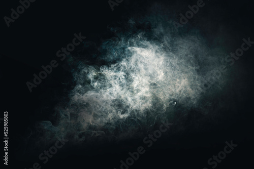 Abstract wisps of smoke on dark, black background for your logo wallpaper or web banner
