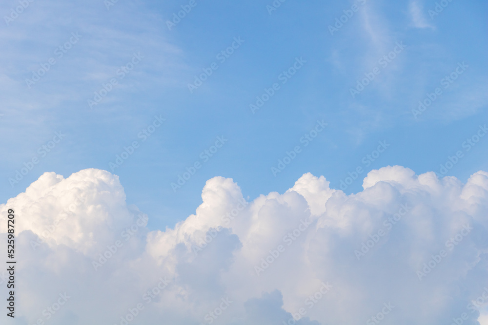 Fluffy clouds in blue sky - From below of fluffy white clouds floating over blue sky Fluffy clouds in blue sky - From below of fluffy white clouds floating over blue sky