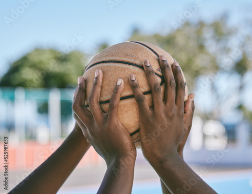 Teamwork, support and hands holding basketball start sports competition, game and league match. Black community of athlete playing, training and competing on outdoor court for good sportsmanship