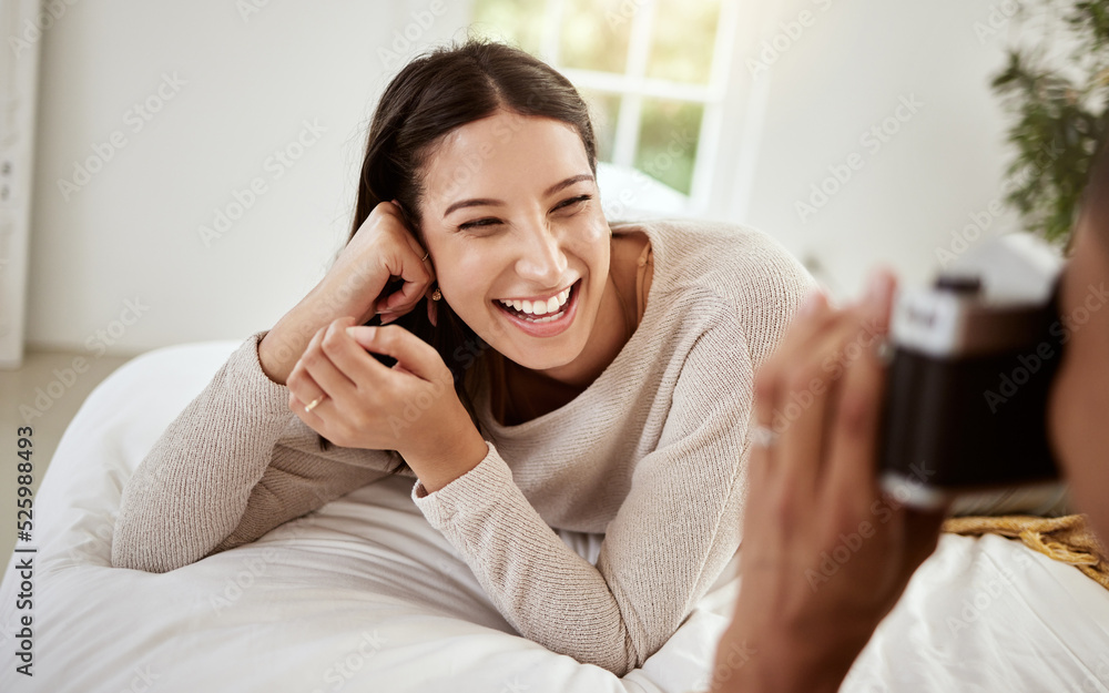 Beautiful, attractive and happy woman having a home photoshoot while lying in bed and smiling. Young excited female having pictures or photos taken while relaxing in her bedroom Beautiful, attractive and happy woman having a home photoshoot while lying in bed and smiling. Young excited female having pictures or photos taken while relaxing in her bedroom
