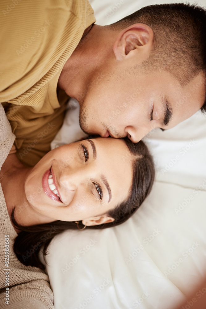 Happy, smiling and affectionate young couple in love taking a selfie together in the bed at home. Portrait of loving female taking a photo in happiness while her partner is sleeping during the day. Happy, smiling and affectionate young couple in love taking a selfie together in the bed at home. Portrait of loving female taking a photo in happiness while her partner is sleeping during the day.
