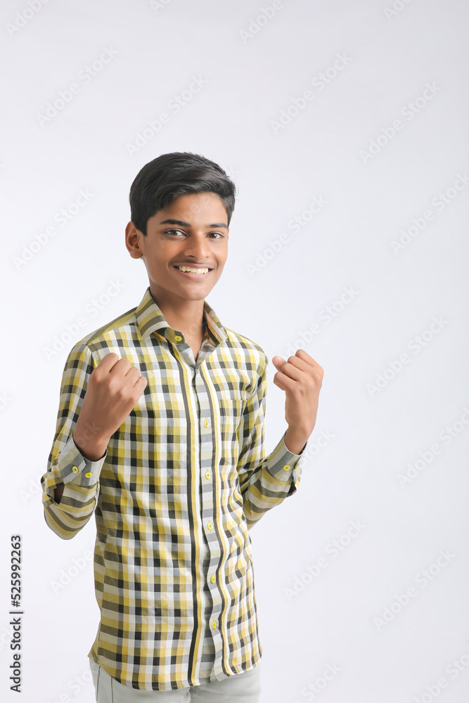 Indian college boy giving expression on white background. Indian college boy giving expression on white background.
