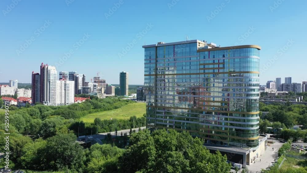 Top view of modern glass building in center of metropolis Top view of modern glass building in center of metropolis