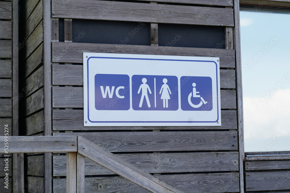 wc Toilet sign icon on wooden building facade water-closets wall