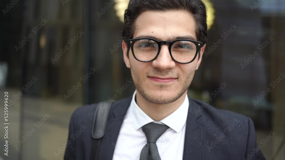 Portrait of a man businessman manager with glasses in a business suit looking at the camera Portrait of a man businessman manager with glasses in a business suit looking at the camera