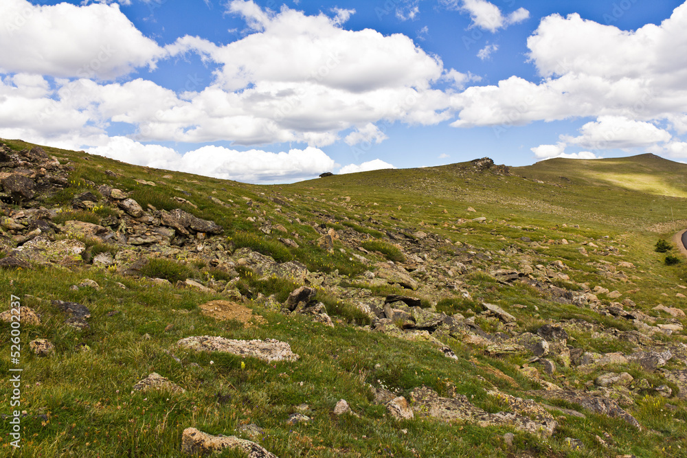 Landscape green mountain on blue sky background with white clouds, clean, windows xp style wallpaper