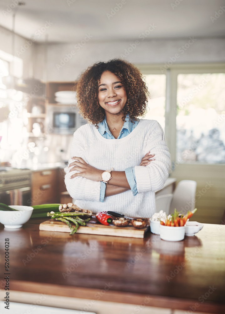 Wellness, cooking and a healthy lifestyle at home with a happy woman starting a weight loss journey. Portrait of a female smiling preparing a nutritious meal with organic vegetables in a kitchen