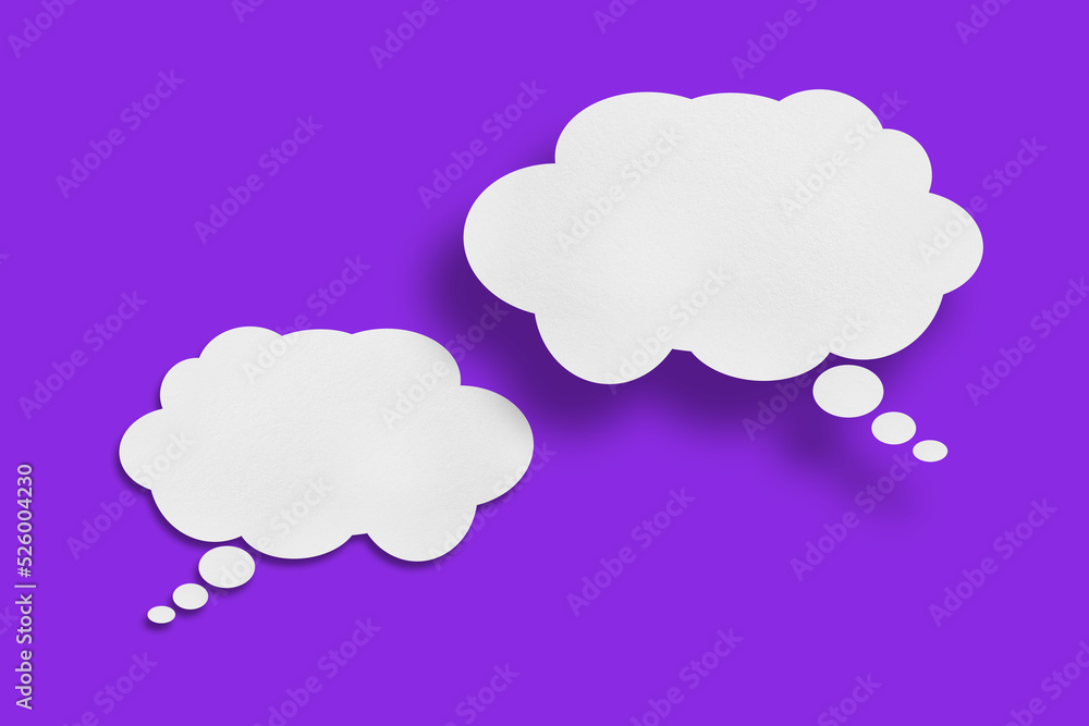 white cloud paper speech bubble shape against purple background
