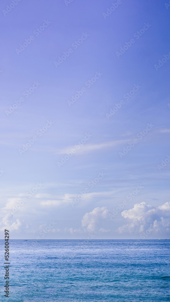 VERTICAL Atmosphere panorama real photo beautiful summer white cloud clear blue PURPLE tone sky horizon line calm sea. Concept paradise life. Design relax wallpaper background. More format in stock