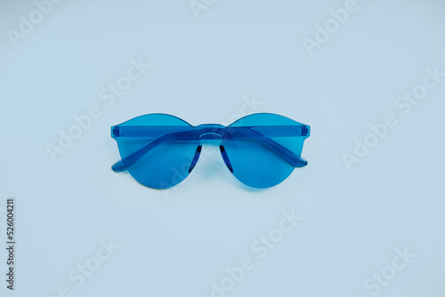 Obraz na płótnie Blue glasses on a pastel blue background